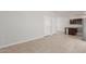 Open concept living area connects kitchen with two doors leading to other rooms at 2000 N 36Th St # 41, Phoenix, AZ 85008