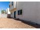 Small backyard with rock groundcover and access door at 2000 N 36Th St # 8, Phoenix, AZ 85008