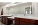 Bathroom with dual sink vanity, white countertops, and a large mirror at 2000 N 36Th St # 8, Phoenix, AZ 85008