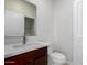 Bathroom featuring a modern vanity with white countertop and wood-finished cabinets at 2000 N 36Th St # 8, Phoenix, AZ 85008