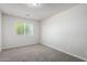 Bright bedroom with neutral carpet, white walls, and a window with natural light at 2000 N 36Th St # 8, Phoenix, AZ 85008