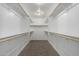 Spacious walk-in closet with multiple shelves and rods at 2000 N 36Th St # 8, Phoenix, AZ 85008