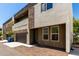 Contemporary home with a two-car garage and stone detailing on the facade at 2000 N 36Th St # 8, Phoenix, AZ 85008