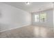 Spacious living room with tiled floors and abundant natural light from large windows at 2000 N 36Th St # 8, Phoenix, AZ 85008