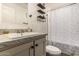 Neutral bathroom with shower curtain and hanging shelves at 2060 N Center St # 133, Mesa, AZ 85201