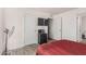 View of carpeted bedroom with TV, dresser, and fan at 2060 N Center St # 133, Mesa, AZ 85201