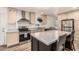Charming kitchen with stainless steel appliances, center island, and attractive countertops at 2060 N Center St # 133, Mesa, AZ 85201
