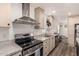 Bright kitchen featuring a stainless steel range and oven, stainless sink, and ample counter space at 2060 N Center St # 133, Mesa, AZ 85201