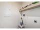 Bright laundry room features clean, white walls and ample storage shelves at 2060 N Center St # 133, Mesa, AZ 85201