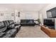 Cozy living room with plush carpet, comfortable seating, and a bright window at 2060 N Center St # 133, Mesa, AZ 85201