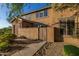 Charming two-story home with stucco and stone exterior, private entrance, and desert landscaping at 2062 W Roy Rogers Rd, Phoenix, AZ 85085