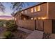 Charming two-story home with stucco and stone exterior, private entrance, and mature landscaping at 2062 W Roy Rogers Rd, Phoenix, AZ 85085