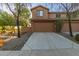 Spacious two-car garage with a wide concrete driveway and desert landscaping at 2062 W Roy Rogers Rd, Phoenix, AZ 85085