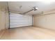 Attached garage with painted floor and walls and an automatic garage door opener at 2062 W Roy Rogers Rd, Phoenix, AZ 85085