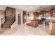 Well-equipped kitchen with stainless steel appliances, granite countertops, and an island, adjacent to the staircase at 2062 W Roy Rogers Rd, Phoenix, AZ 85085