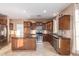 Modern kitchen featuring stainless steel appliances, granite countertops, and abundant cabinet space at 2062 W Roy Rogers Rd, Phoenix, AZ 85085