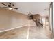 Open-concept living area with a staircase and tile flooring at 2062 W Roy Rogers Rd, Phoenix, AZ 85085