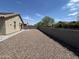 Large backyard is rocks with privacy wall, perfect for entertaining at 22325 N 185Th Ave, Surprise, AZ 85387