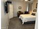 Queen bedroom featuring warm neutral decor, dresser, and flat screen TV at 22325 N 185Th Ave, Surprise, AZ 85387