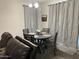 Dining area with table, chairs, updated lighting, and modern decor at 22325 N 185Th Ave, Surprise, AZ 85387