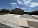 Charming single-story home featuring a wide driveway and three-car garage at 22325 N 185Th Ave, Surprise, AZ 85387
