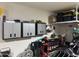 Garage interior featuring ample storage and workbench at 22325 N 185Th Ave, Surprise, AZ 85387