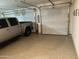 Spacious three-car garage with epoxy flooring offering ample parking and storage at 22325 N 185Th Ave, Surprise, AZ 85387