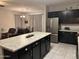 Modern kitchen with granite countertops, stainless steel appliances, and dark cabinetry at 22325 N 185Th Ave, Surprise, AZ 85387