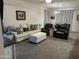 Cozy living room with carpeted floor, neutral-toned furniture, and natural lighting at 22325 N 185Th Ave, Surprise, AZ 85387