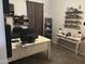 Home office with a desk, shelves, and natural light, perfect for remote work at 22325 N 185Th Ave, Surprise, AZ 85387