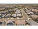 A suburban neighborhood with a mix of desert landscaping and tile roofs, stretches into the distance at 22657 N 184Th Ln, Surprise, AZ 85387