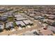 Expansive suburban community nestled amongst desert landscaping with single-story homes and tile roofs at 22657 N 184Th Ln, Surprise, AZ 85387