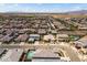 Aerial shot of a suburban neighborhood showcases desert landscaping, single-story homes, and a community pool at 22657 N 184Th Ln, Surprise, AZ 85387