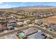 Expansive aerial view of a desert community showcasing well-maintained homes and scenic mountain backdrop at 22657 N 184Th Ln, Surprise, AZ 85387