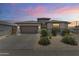 Charming single-story home featuring low-maintenance landscaping, neutral paint, and a welcoming front-facing two-car garage at 22657 N 184Th Ln, Surprise, AZ 85387