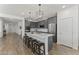 Modern kitchen featuring stainless steel appliances, a large island, and stylish pendant lighting at 22657 N 184Th Ln, Surprise, AZ 85387