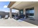 Comfortable covered patio with stylish furniture, perfect for relaxing and entertaining outdoors at 22657 N 184Th Ln, Surprise, AZ 85387
