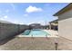 Inviting backyard with a pool, spa, and relaxing lounge area, perfect for outdoor enjoyment at 22657 N 184Th Ln, Surprise, AZ 85387