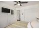 Comfortable bedroom features a ceiling fan, and a sliding door closet, creating a clean and peaceful ambiance at 2746 E Fawn Dr, Phoenix, AZ 85042
