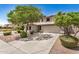 Charming two-story home with desert landscaping, mature trees, and a spacious driveway at 2746 E Fawn Dr, Phoenix, AZ 85042