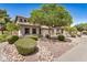 A beautiful home with a two-car garage, manicured landscaping, and a lovely shade tree at 2746 E Fawn Dr, Phoenix, AZ 85042
