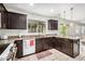 Bright kitchen featuring a white dishwasher and oven, granite countertop and a window with a view at 2746 E Fawn Dr, Phoenix, AZ 85042