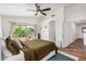 Spacious bedroom with a large window and private balcony, complete with hardwood floors at 2746 E Fawn Dr, Phoenix, AZ 85042