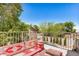Relaxing patio area with an ornate bohemian-style seating, surrounded by green trees, offering a private retreat at 2746 E Fawn Dr, Phoenix, AZ 85042