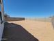 Large backyard surrounded by a block wall, providing privacy and ample space for outdoor activities at 3550 N Camden Dr, Florence, AZ 85132