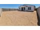 Spacious backyard with dirt awaiting your custom landscaping ideas, perfect for creating your outdoor retreat at 3550 N Camden Dr, Florence, AZ 85132