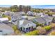 Aerial view showcasing the home's backyard, pool, patio, and surrounding lush greenery at 3718 E Sells Dr, Phoenix, AZ 85018