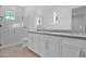 Bright bathroom featuring white cabinets, and shower at 3718 E Sells Dr, Phoenix, AZ 85018