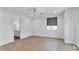 Bright bedroom with neutral colors, wood floors, and a view of an ensuite bathroom at 3718 E Sells Dr, Phoenix, AZ 85018