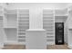 Spacious walk-in closet with built-in shelving, a storage island, and a safe at 3718 E Sells Dr, Phoenix, AZ 85018